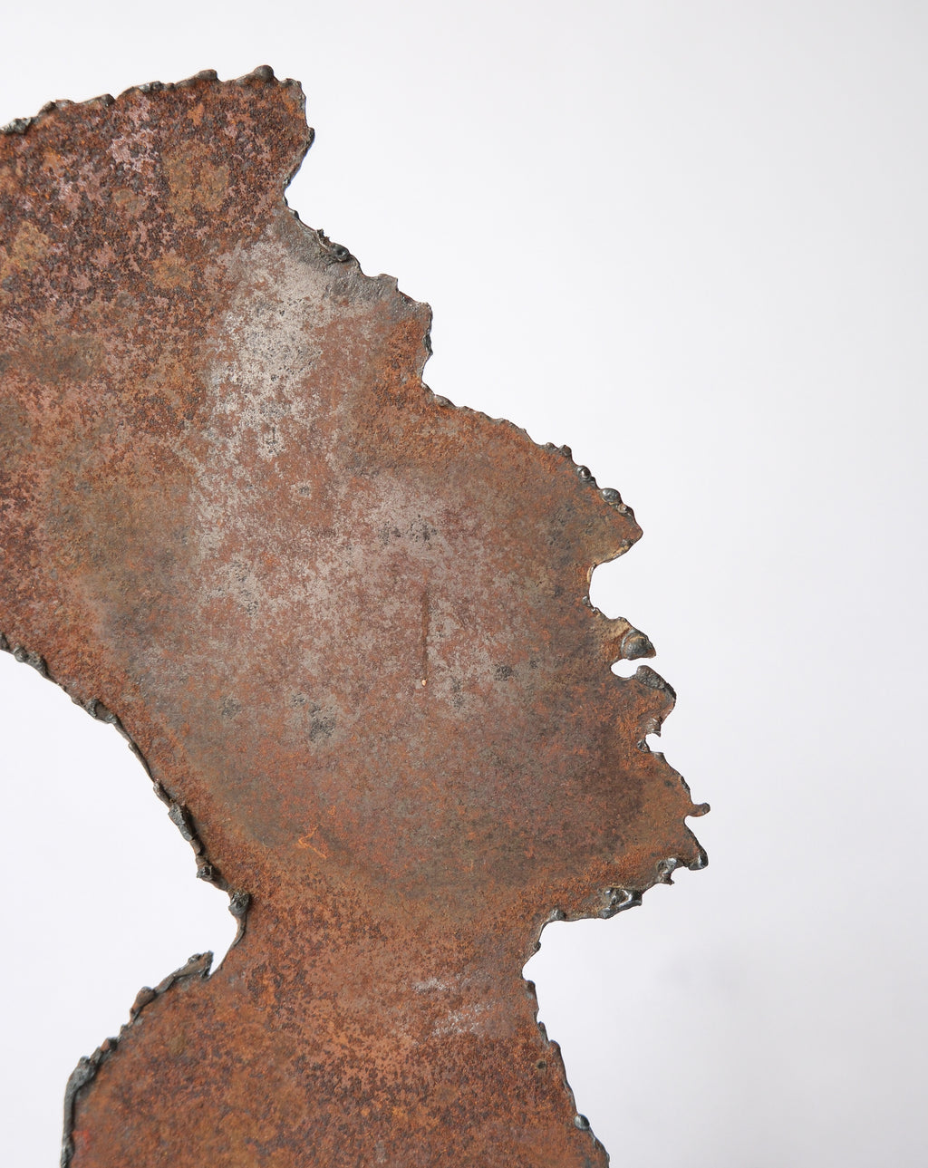 Rustic iron face silhouette