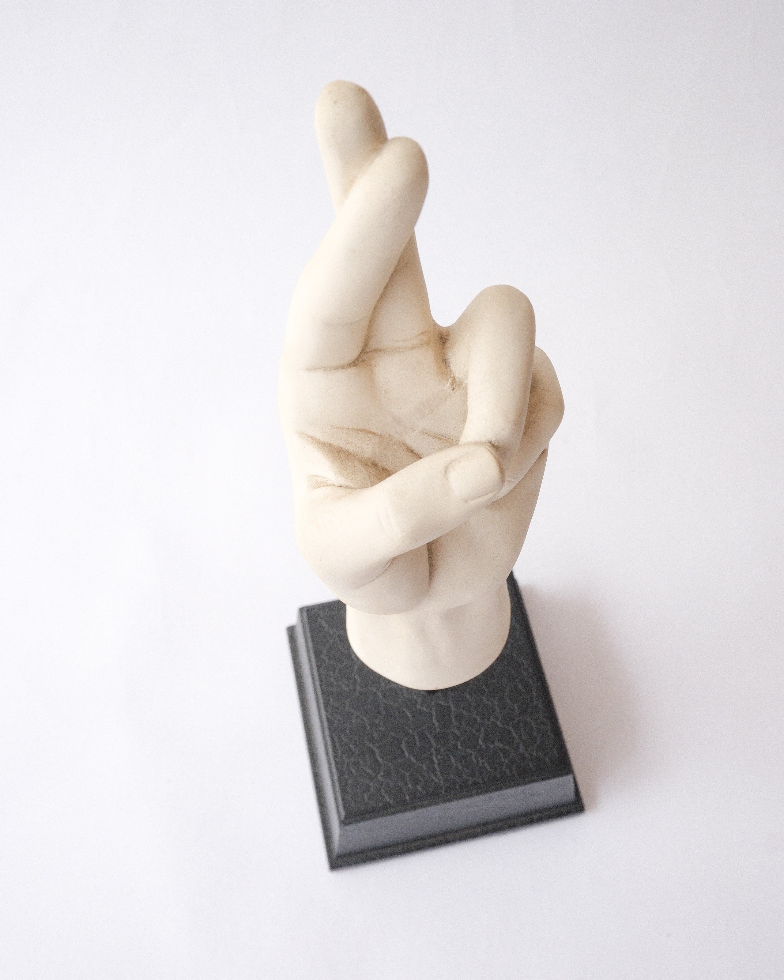 Hand sign plaster sculpture