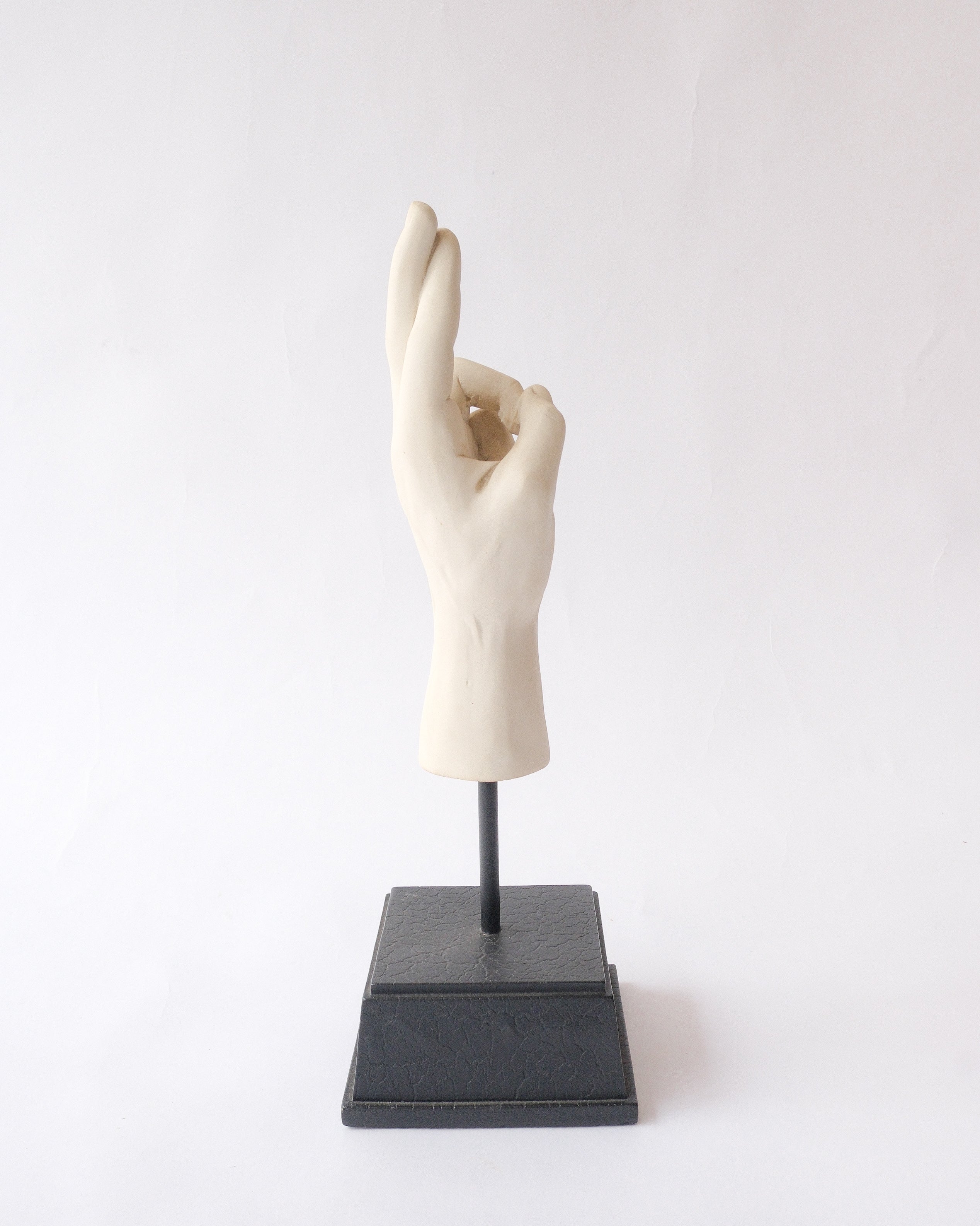 Hand sign plaster sculpture